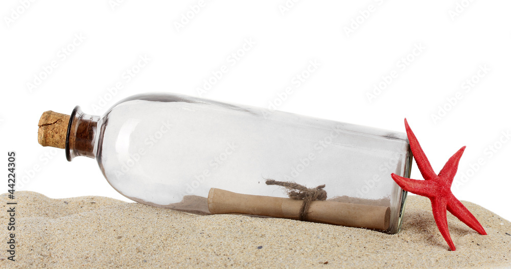 Glass bottle with note inside on sand isolated on white