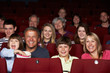 © Monkey Business - Family Watching Film In Cinema