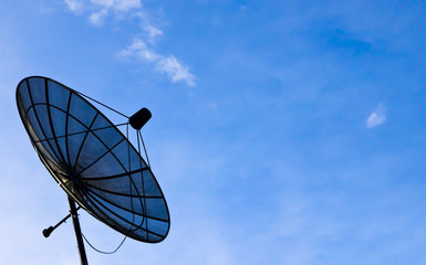 Satellite dish antennas under blue sky