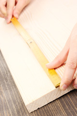 Poster - measuring wooden board close-up