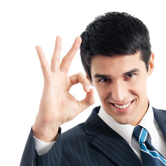 Businessman with okay gesture, isolated