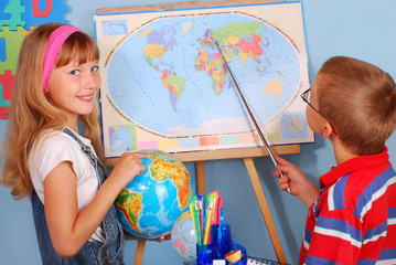 schoolgirl  and schoolboy on geography lesson