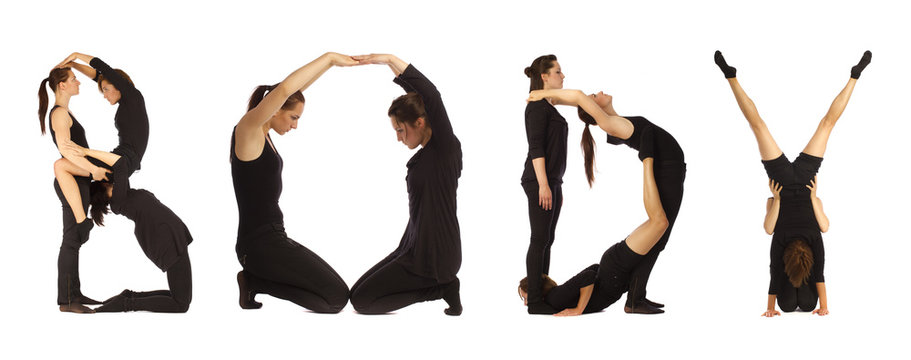 Black dressed people forming BODY word over white 