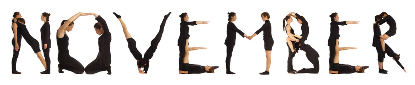Black dressed people forming NOVEMBER word over white 