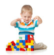© Oksana Kuzmina - kid playing toy blocks  isolated on white background