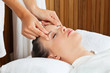 Female Receiving Head Massage At Spa