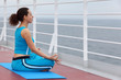 © Pavel Losevsky - Young woman dressed in blue sports suit sits on cruise liner