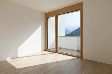 empty room with window and parquet