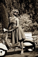 Wall Mural - Woman in retro dress with a scooter