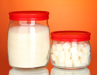 Jars with white lump sugar and white crystal sugar isolated