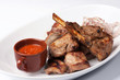 Grilled meat with red sauce