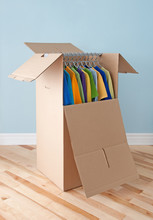 Wardrobe Box With Colorful Clothing, Ready For Moving