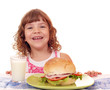 happy little girl with sandwich and milk