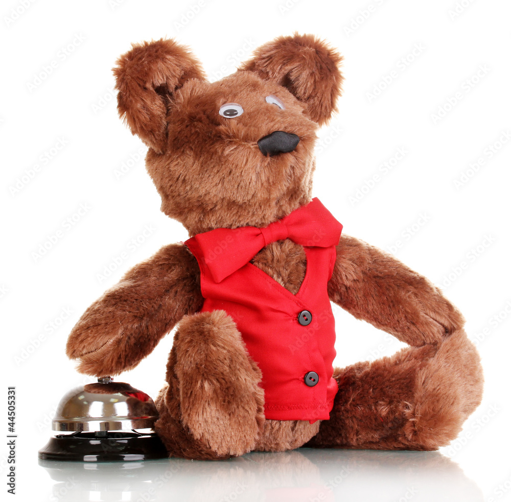 Toy bear and bell isolated on white