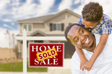 Wall Mural - Mixed Race Father and Son In Front of Real Estate Sign and House