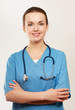 © shefkate - Happy young nurse standing with folded arms