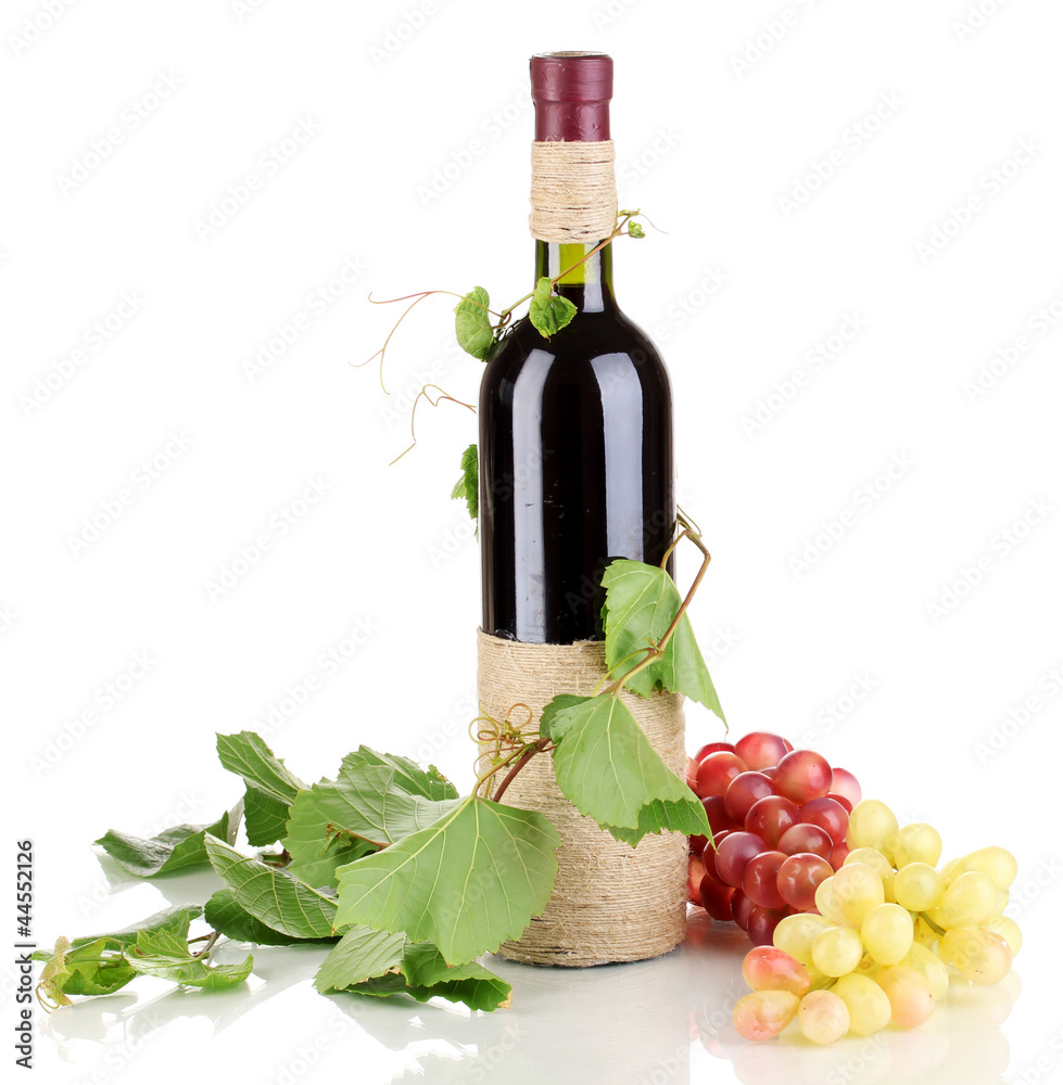 bottle of wine with grape leaves isolated on white