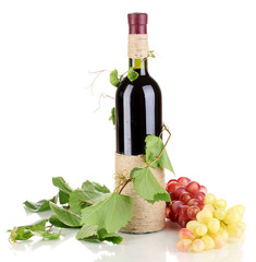 Wall Mural - bottle of wine with grape leaves isolated on white