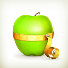 Tape measurement and green apple