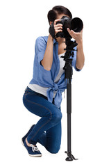 Wall Mural - Woman takes images holding photographic camera