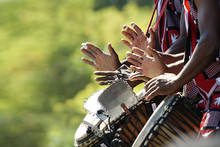 Hands Beating Drums