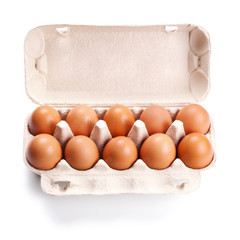Wall Mural - brown eggs in a carton box isolated on white