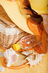 Wall Mural - Beach items a hat, a towel and slippers, a close up