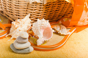 Wall Mural - Beach items a hat, a towel and slippers, a close up