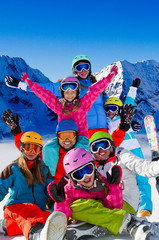 Fototapete - Skiing, winter fun - happy skiers, family ski team