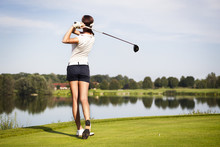 Golf Player Teeing Off