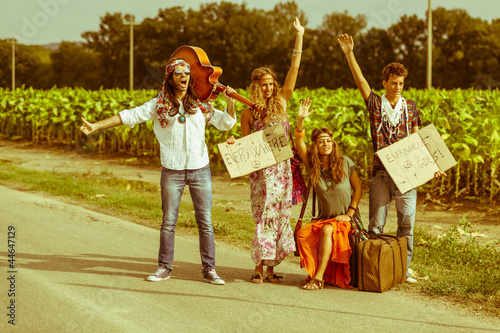 Obraz w ramie Hippie Group Hitchhiking on a Countryside Road