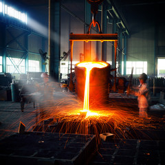 Pouring of liquid metal in open hearth workshop