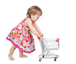 Little girl pushing a trolley