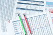 © farizaa - two color pens over financial reports