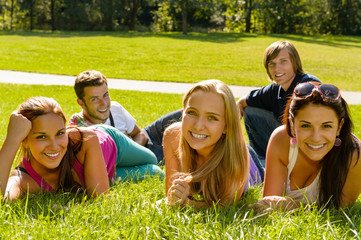 Sticker - Students laying on grass in park campus