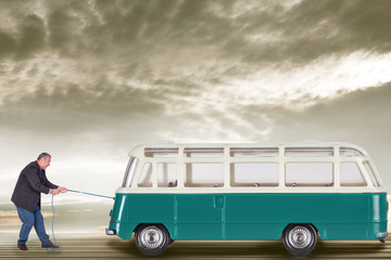 Man with rope pulls bus