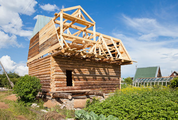 Canvas Print - Construction of a new wooden house.