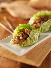 Wall Mural - Asian lettuce wrap with minced chicken and seasonings