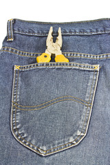 yellow pliers in pocket jeans on white