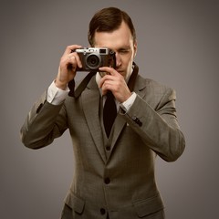 Wall Mural - Businessman with a retro camera