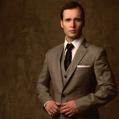 Wall Mural - Handsome young man in classic suit