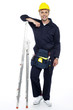 © stockyimages - Industrial engineer resting his hands on stepladder