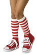 Girl with striped socks and red shoes. Clipping path included.