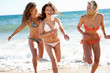 © Monkey Business - Group Of Teenage Girls Enjoying Beach Holiday Together