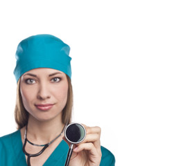 Happy young nurse standing with folded arms isolated