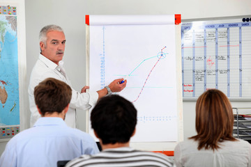 mature businessman making presentation