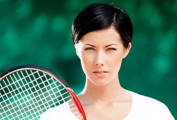 Wall Mural - Portrait of successful female tennis player 