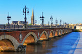 Fototapeta Na drzwi - Bordeaux river bridge with St Michel cathedral