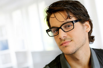 Portrait of handsome young man with glasses