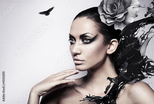 Naklejka dekoracyjna portrait of sexy brunette woman with black splash and rose